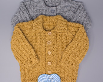 May include: Two knitted cardigans, one mustard yellow and one grey, with wooden buttons. The yellow cardigan has a label that reads "Designs by Tracy D."