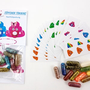 Pode incluir: Um conjunto de cápsulas de glitter coloridas e adesivos para o treinamento do penico. Os adesivos apresentam diferentes emojis de cocô coloridos com rostos. A embalagem diz "Sh*t the Glitter" e "Töpfchen Training Nachfüllpackung".
