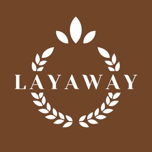 May include: White logo with the word "LAYAWAY" in a serif font, surrounded by a wreath of leaves. The wreath is topped with a stylized flower with five petals.