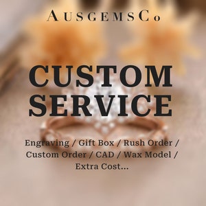 May include: A close-up of a ring with a diamond center stone. The text "AUSGEMSCo CUSTOM SERVICE" is displayed above the ring. The text "Engraving / Gift Box / Rush Order / Custom Order / CAD / Wax Model / Extra Cost..." is displayed below the ring.