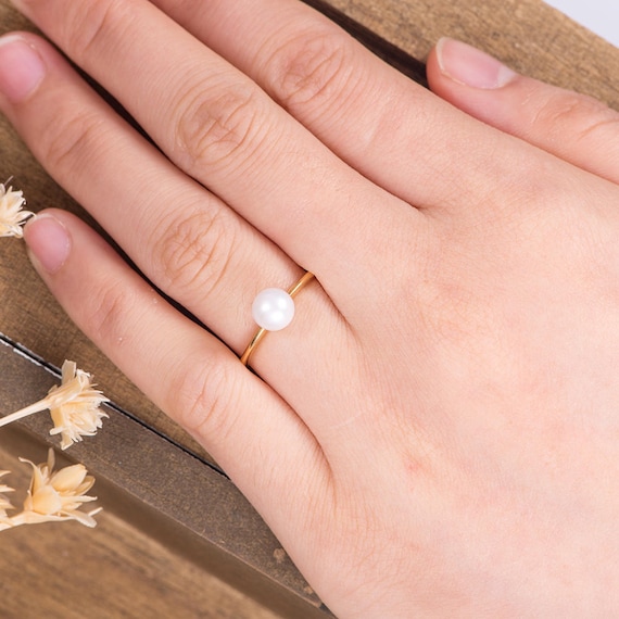 Simple pearl 2024 engagement rings