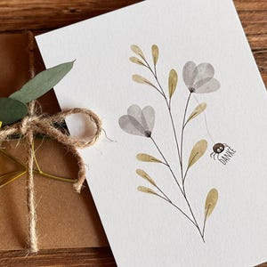 Postal de papel natural "Gracias" con araña en estilo escandinavo.