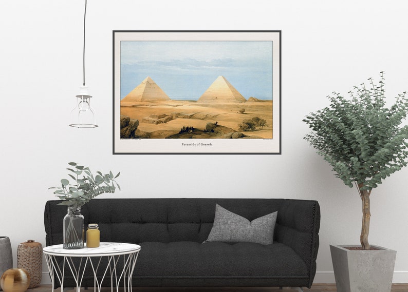 May include: A vintage illustration of the Pyramids of Giza, showing two large pyramids in the desert landscape. The image is in a black frame and has the text "Pyramids of Gizeh" at the bottom.