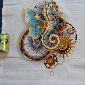 May include: A cross-stitch pattern featuring a gold and blue steampunk seahorse with gears and a compass. The seahorse has a butterfly wing design.