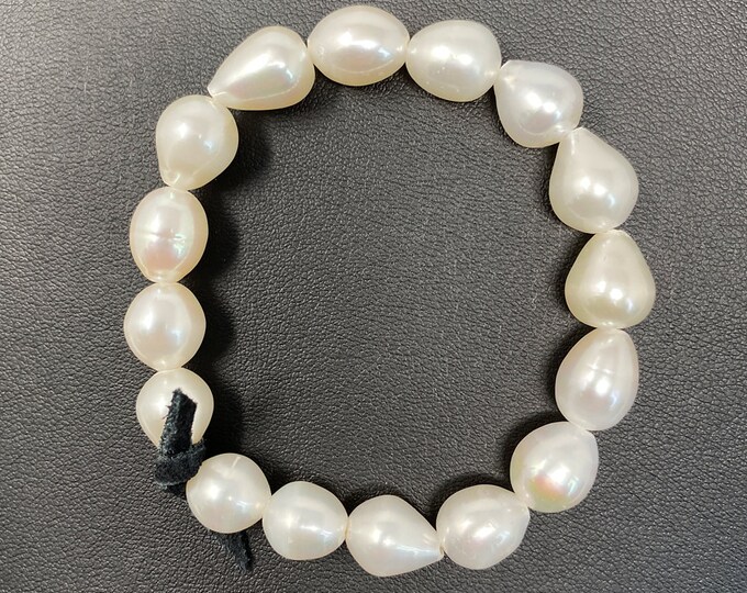 A Beautiful Handmade Freshwater Pearl Bracelet Finished With White Pear Drop Pearls