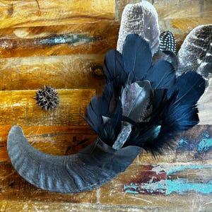 New Moon Smudge fan with Icelandic sheep horn handle and quartz crystal. Large. feathers in iridescent blacks, copper, and hints of bronze.