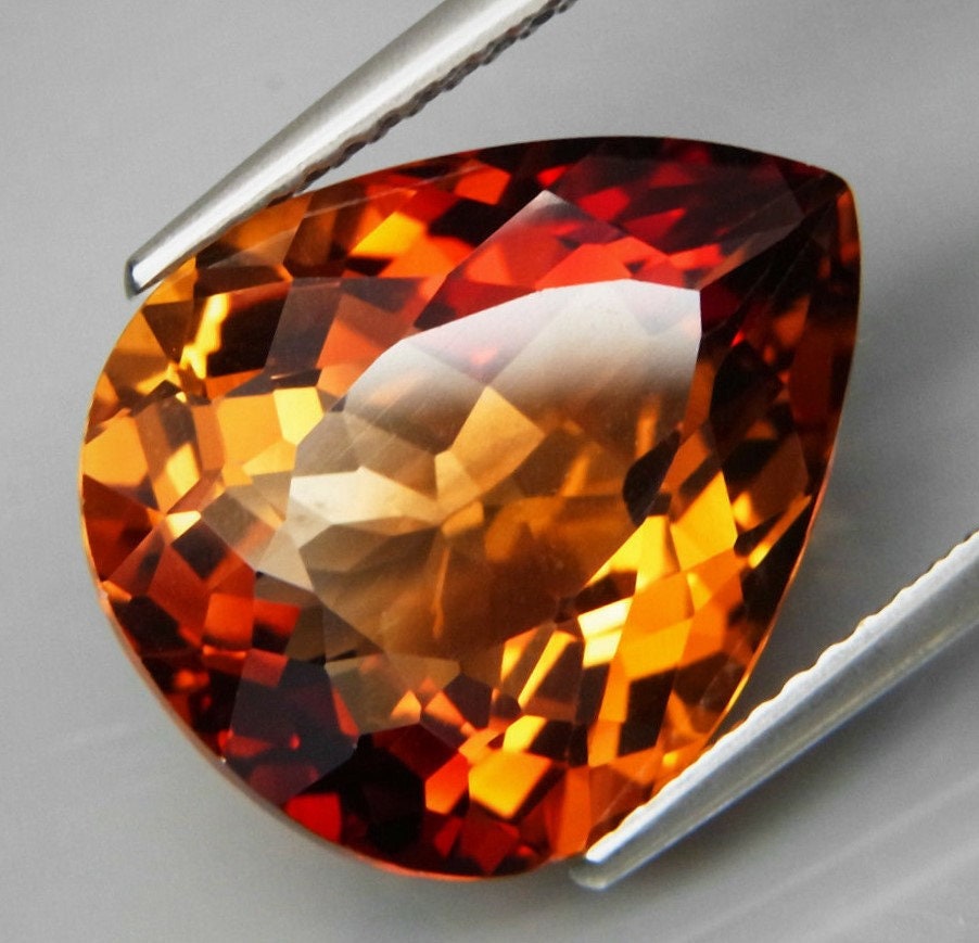 superior eye clean 11.96ct. from Brazil Imperial champagne color Big Imperial Topaz gemstone full sparkling