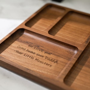 May include: A wooden tray with three compartments, engraved with the message "We LOVE you! Come home soon Daddy! -Your Little Monsters".