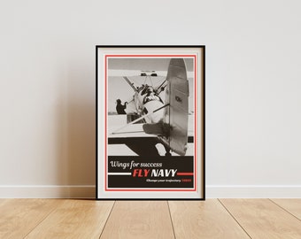May include: A vintage black and white poster with a red border. The poster features a black and white photo of a biplane with the text "Wings for success - FLY NAVY - Change your trajectory TODAY".