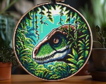 May include: A cross stitch pattern of a dinosaur's head peeking out from behind green foliage. The dinosaur's eye is a bright orange, and its teeth are visible. The background is a blue-green color.
