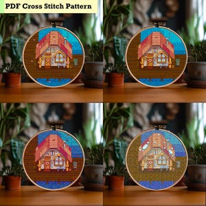 May include: Four cross-stitch patterns in embroidery hoops. Each depicts a pixelated house with a red roof, blue sky, and wooden dock. The text "PDF Cross Stitch Pattern" is at the top. The hoops are on a wooden surface.