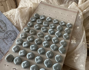 Stunning antique 1920s French button card with 48 dainty buttons in baby blue