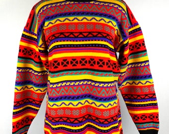 May include: A colorful striped sweater with a geometric pattern in shades of red, yellow, green, blue, black, and gray.