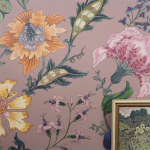 May include: A floral wallpaper design with pink, yellow, and green flowers on a light pink background. The wallpaper features a repeating pattern of stylized flowers and leaves.