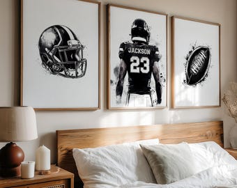 May include: Set of three framed art prints featuring football-themed illustrations. The prints showcase a football helmet, a player with the name "Jackson" and the number "23", and a football. The artwork is in black and white.