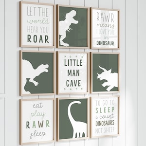 May include: Nine framed prints with green backgrounds and white dinosaur silhouettes. The prints feature text such as "Let the world hear you roar", "Rawr means I love you in dinosaur", "Little man cave", "Eat play rawr sleep", and "To go to sleep I count dinosaurs not sheep".