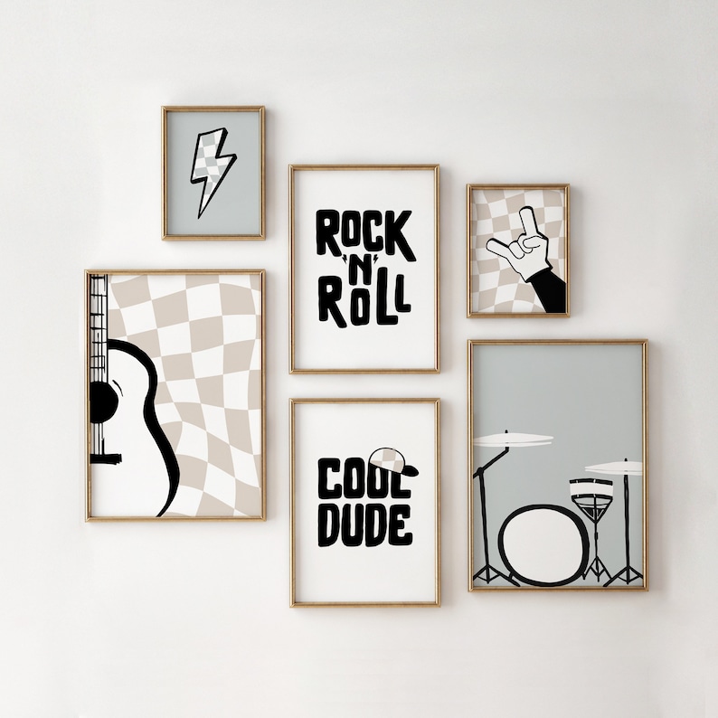 May include: A set of six black and white framed prints with a rock and roll theme. The prints feature a guitar, a drum set, a lightning bolt, a hand making the rock and roll sign, and the words "Rock 'n' Roll" and "Cool Dude".