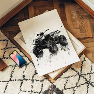 May include: A black and white watercolor-style art print featuring an all-terrain vehicle with large, knobby tires and a detailed frame. The illustration uses ink splatters and washes to create a dynamic sense of motion on a white background.