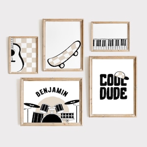 May include: Five black and white illustrations in wooden frames. The illustrations include a skateboard, a guitar, a drum set, a piano keyboard, and the words "Cool Dude" with a checkered baseball cap.