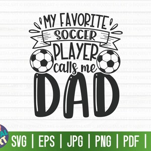 May include: Black and white graphic design with the text "My Favorite Soccer Player Calls Me Dad" with two soccer balls on either side of the text.