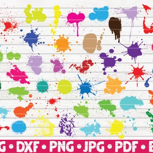 May include: A collection of 40 colorful paint splatters in various shapes and sizes. The splatters are on a white wood background.