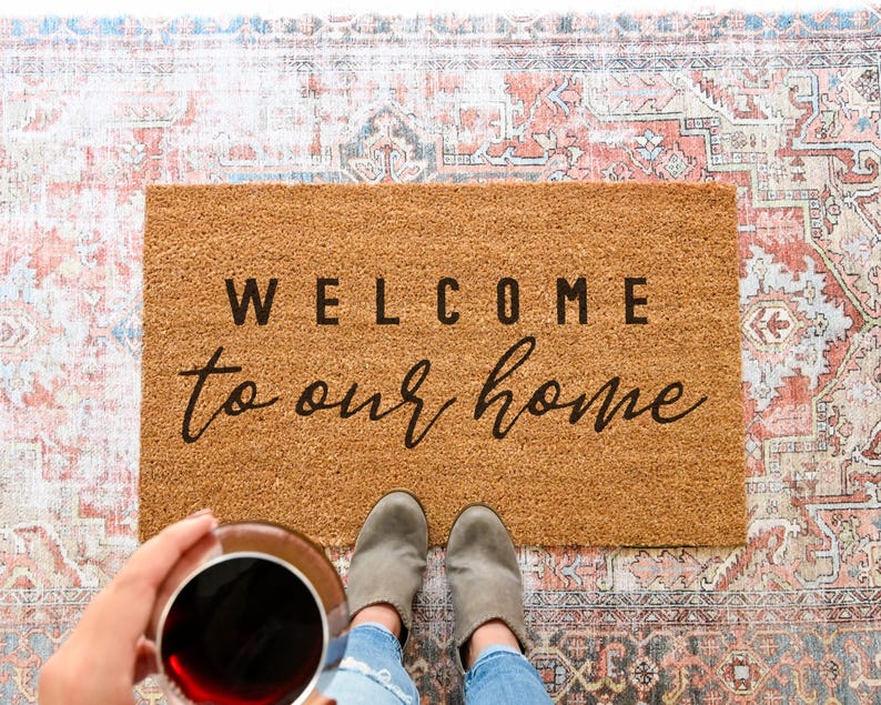 Coir welcome to our home doormat.  Welcome bold and to our home in cursive.
