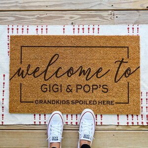 custom grandparents doormat that says welcome to nana and papa's house. Grandkids spoiled here