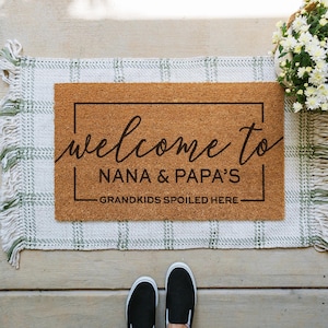 custom grandparents doormat that says welcome to nana and papa's house. Grandkids spoiled here