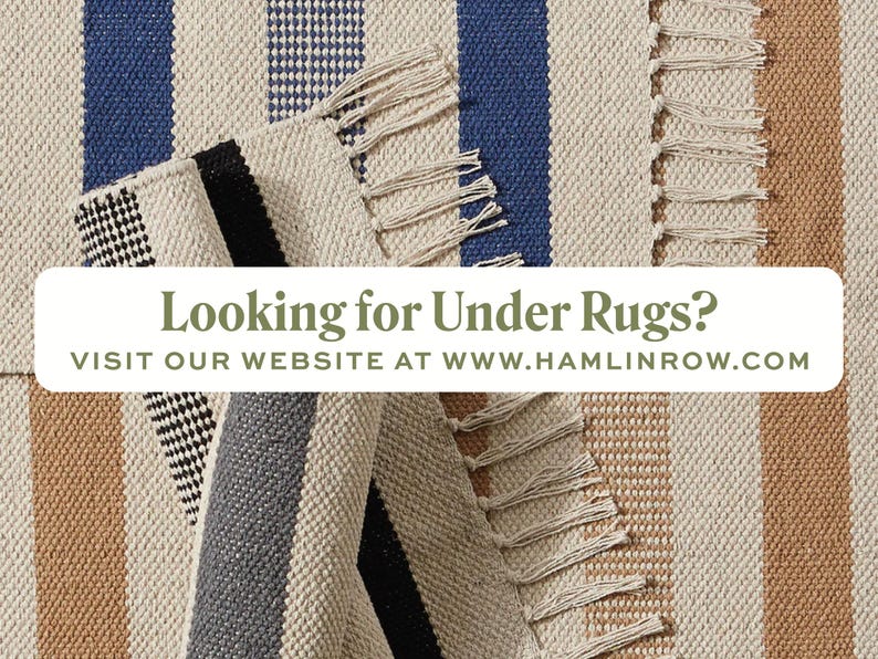 May include: A close-up of three striped rugs with fringed edges. The rugs are in shades of beige, brown, blue, and grey. The text "Looking for Under Rugs? VISIT OUR WEBSITE AT WWW.HAMLINROW.COM" is displayed on a white banner.