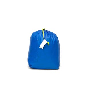 May include: A blue drawstring bag with a white tag attached to the drawstring. The bag is made of a water-resistant material and is ideal for storing small items.