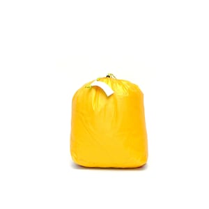 May include: A bright yellow drawstring bag made of nylon. The bag is empty and has a white tag attached to the drawstring.