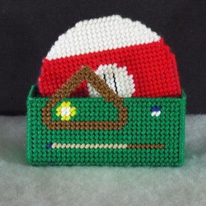 May include: A green felt pool table with a brown wooden frame and a red and white snooker ball on top. The table is made of plastic canvas and is a handmade craft.