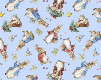 May include: A blue and white fabric with a repeating pattern of Peter Rabbit characters. The characters are wearing blue jackets and are holding carrots. The background is a light blue color.