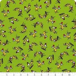 May include: A green fabric with a repeating pattern of yellow and black cartoon dogs wearing red hats. The dogs are in various poses, some are sitting, some are standing, and some are running.