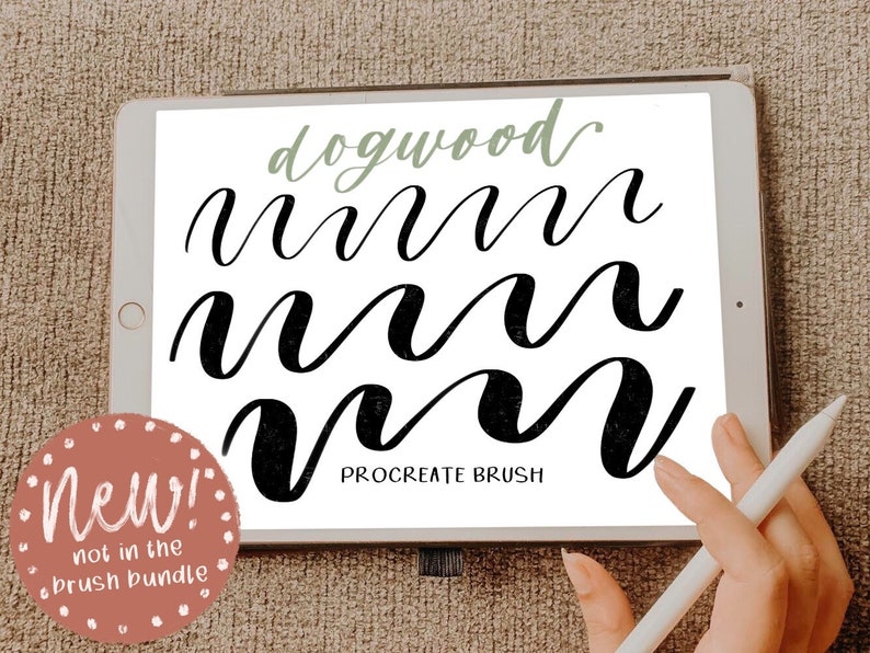 May include: A digital illustration of the word "dogwood" written in a cursive script on a white background. The word is written in black ink and is shown in three different sizes. The image is displayed on a digital tablet with a stylus pen nearby. The text "PROCREATE BRUSH" is written below the word "dogwood". A pink circle with white polka dots and the text "New! not in the brush bundle" is in the lower left corner of the image.
