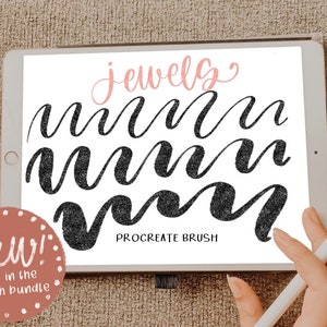 May include: A digital illustration of a Procreate brush called "jewelry" on a tablet screen. The brush is used to create a series of black cursive "m" letters. The tablet is on a brown surface. The text "New! Not in the brush bundle" is in a pink circle on the left side of the image.