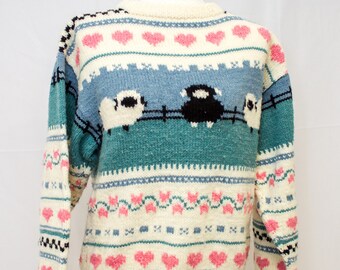 Hand knit Sweater with adorable sheep and heart pattern.