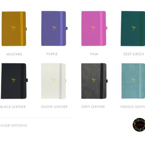 May include: Eight different color options for a notebook. The colors are mustard, purple, pink, deep green, black leather, snow leather, grey leather, and indigo leather.