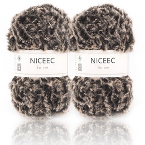 May include: Two skeins of brown and beige faux fur yarn. Each skein has a white label that reads "NICEEC Fur yarn".