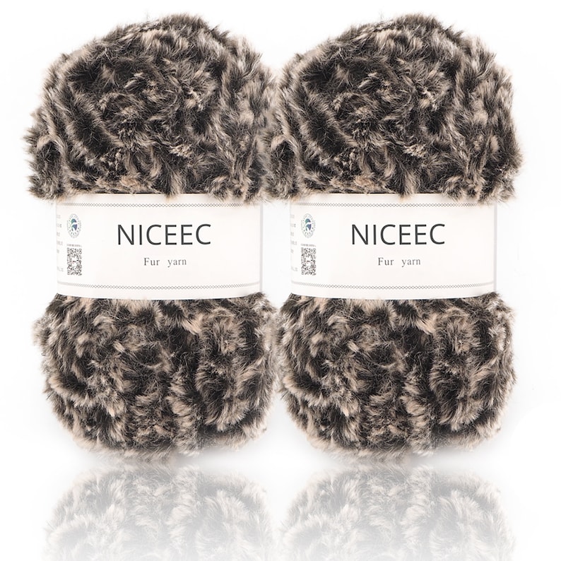 May include: Two skeins of brown and beige faux fur yarn. Each skein has a white label that reads "NICEEC Fur yarn".