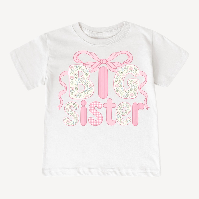 May include: White t-shirt with the words "BIG sister" in pink. The letters "B" and "G" are filled with a floral pattern, while the "I" is solid pink. The "S" and "E" are floral, and the "T" and "R" are pink gingham.