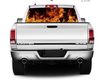 May include: A white pickup truck with a black "LIMITED" and "4x4" emblem on the tailgate. The rear window has a flame graphic decal.