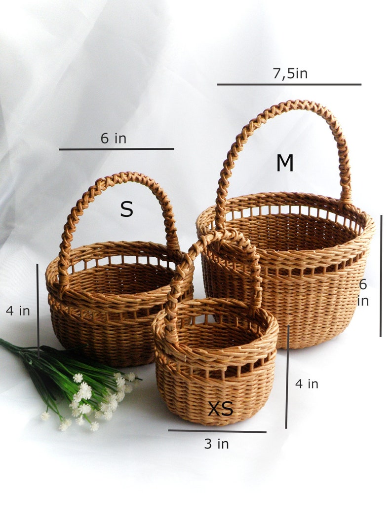 Set of three round baskets in brown color. Baskets are made using weaving technique in three different sizes. Baskets can be used as wedding baskets for flower girls of different ages from 2-12 years old.