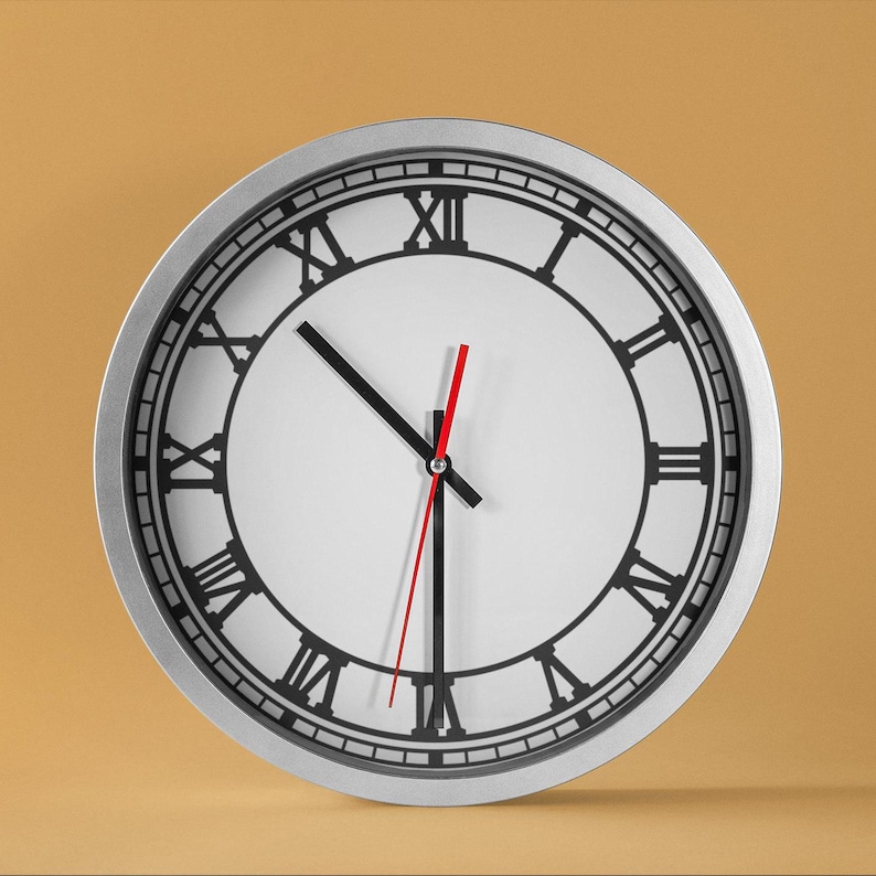 May include: A silver clock with black Roman numeral markings and black hour and minute hands. The clock has a white face and a red second hand.