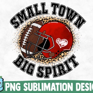 May include: A sublimation design featuring a football helmet and football with a leopard print background. The text "Small Town Big Spirit" is written in a black circular frame.