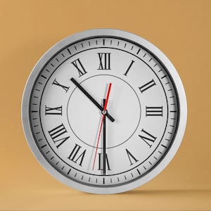 May include: A silver-framed clock with Roman numeral markings and black hands. The clock face is white with a red second hand.