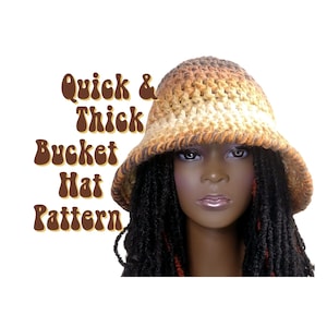 May include: A crochet bucket hat pattern in brown, beige, and orange. The hat is being modeled by a person with long black and orange dreadlocks. The text "Quick & Thick Bucket Hat Pattern" is written in brown letters with a retro font.