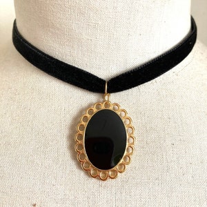 Black velvet choker necklace with black and gold enamel oval pendant