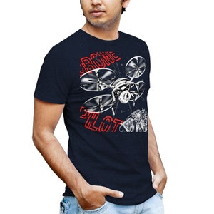 May include: A navy blue t-shirt with a graphic of a drone and the text "Drone Pilot" in red.