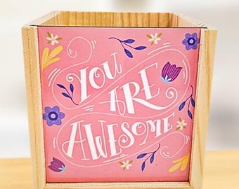 Pink background with floral design - personalised pen pot - crafted from spruce pine - a stylish desk touch - vibrant colours